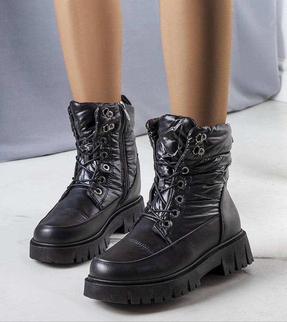 Andlina black waterproof fur-lined snow boots with high gripping sole, ideal for winter protection and style.