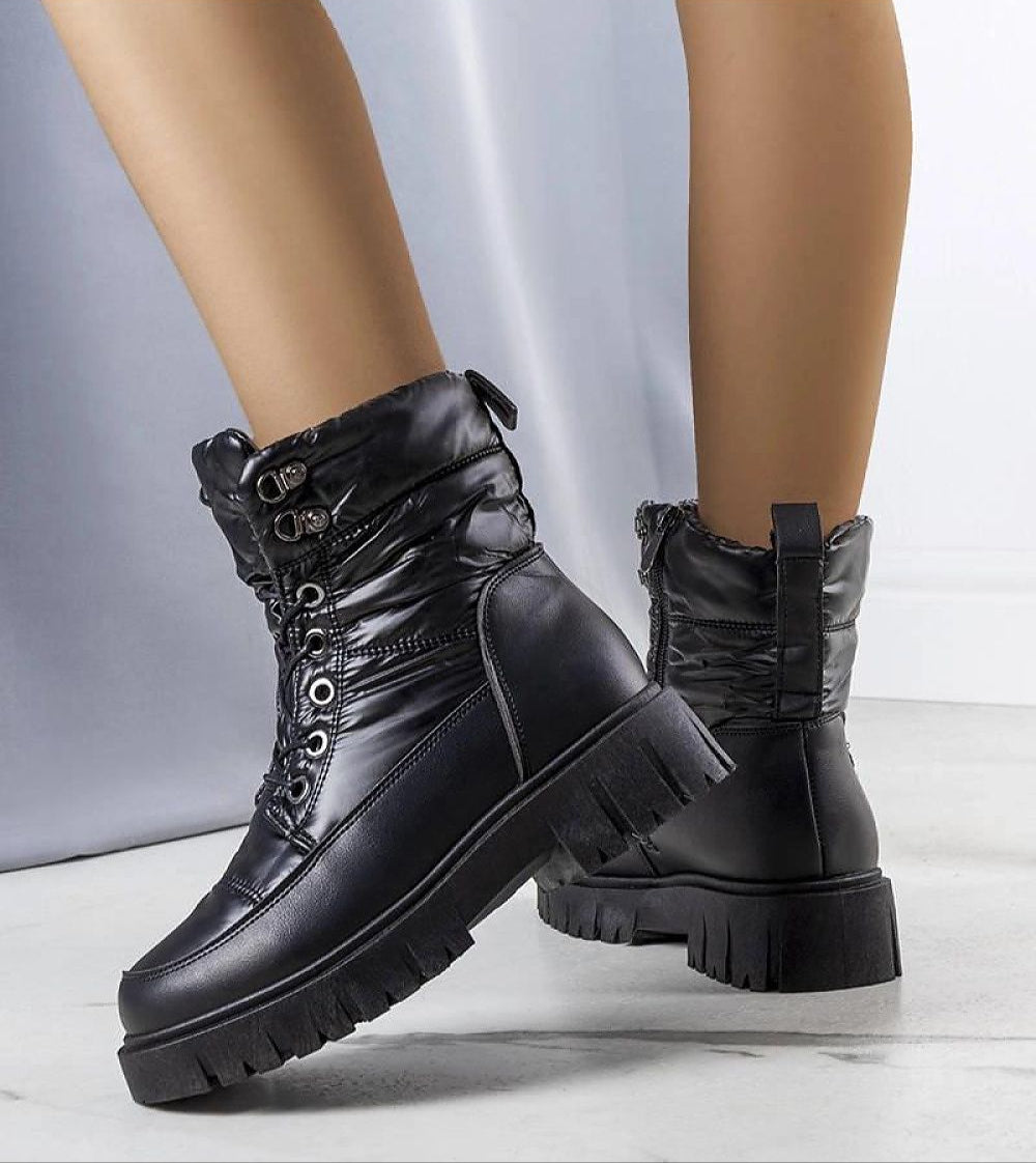 Andlina waterproof fur-lined snow boots in black, featuring a high sole for winter traction, crafted from eco leather.