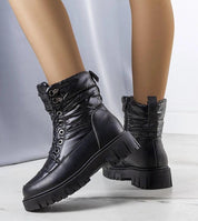 Andlina waterproof fur-lined snow boots in black, featuring a high sole for winter traction, crafted from eco leather.