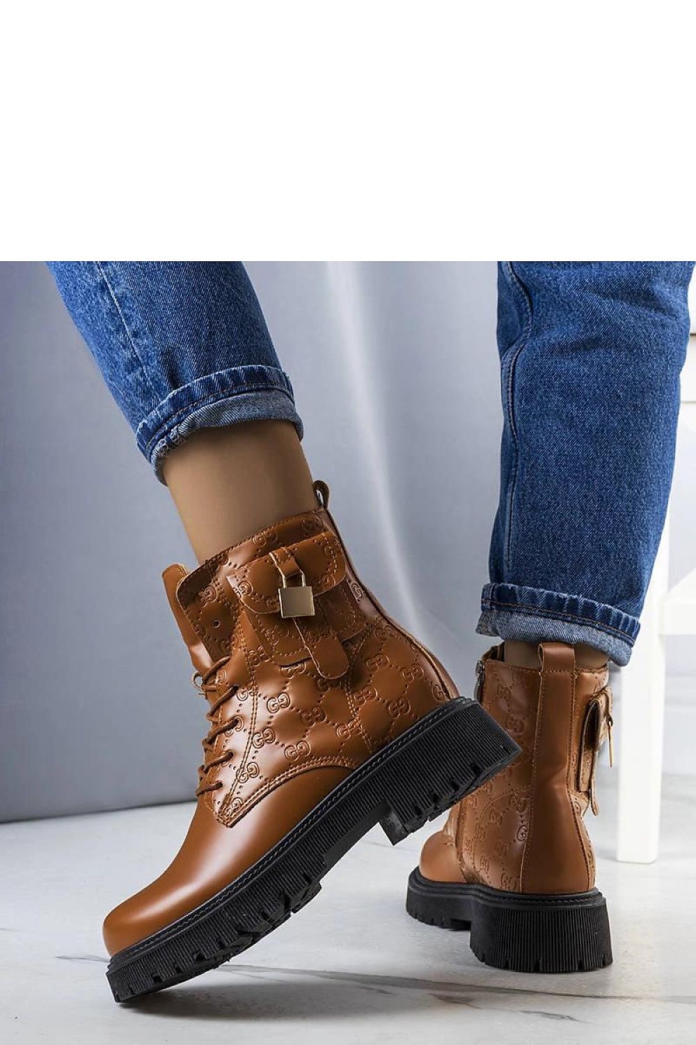 Coanira brown trapper boots with mini padlock, embossed eco leather, faux fur lining, worn with jeans, stylish winter footwear.