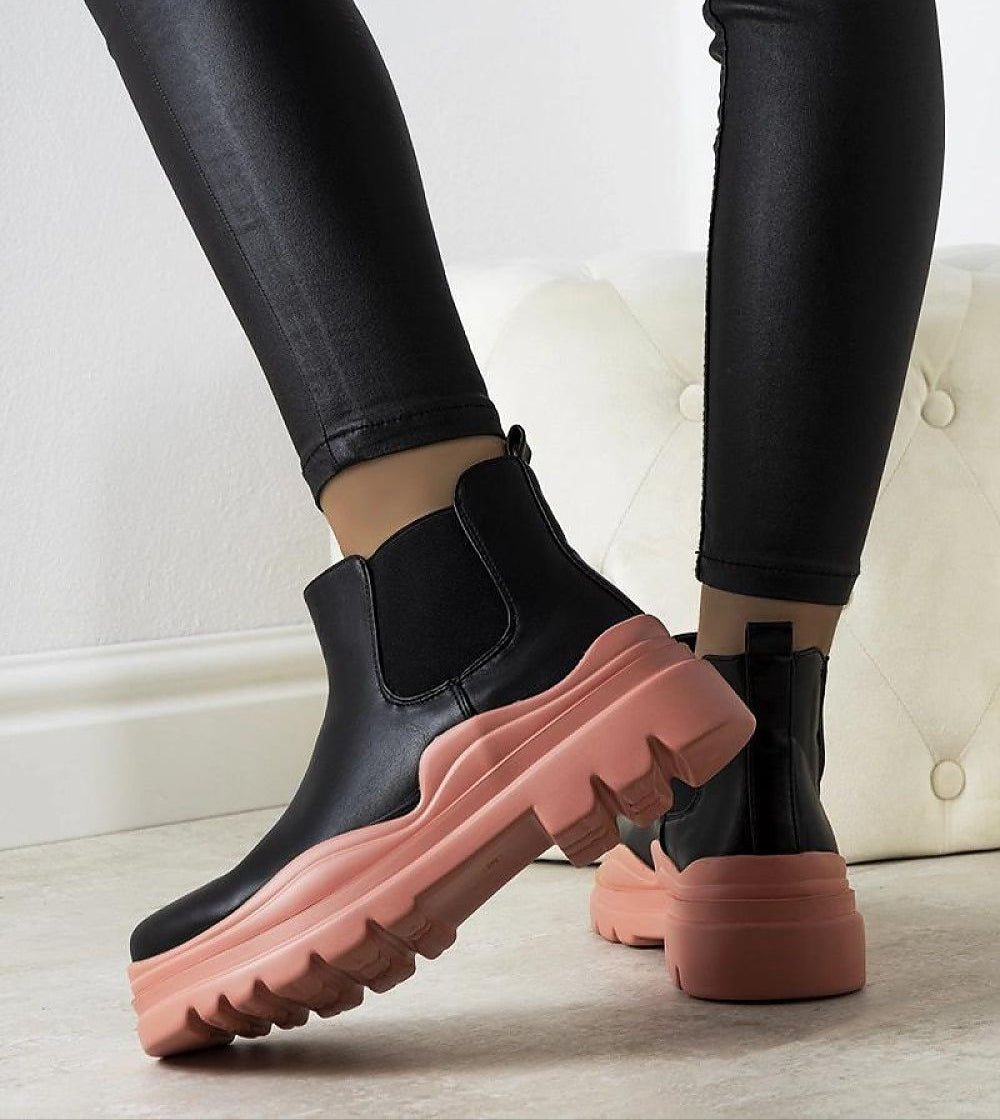 Ravela black boots with pink platform, featuring elastic sides and eco leather, offering bold style and comfort for autumn-winter wear.