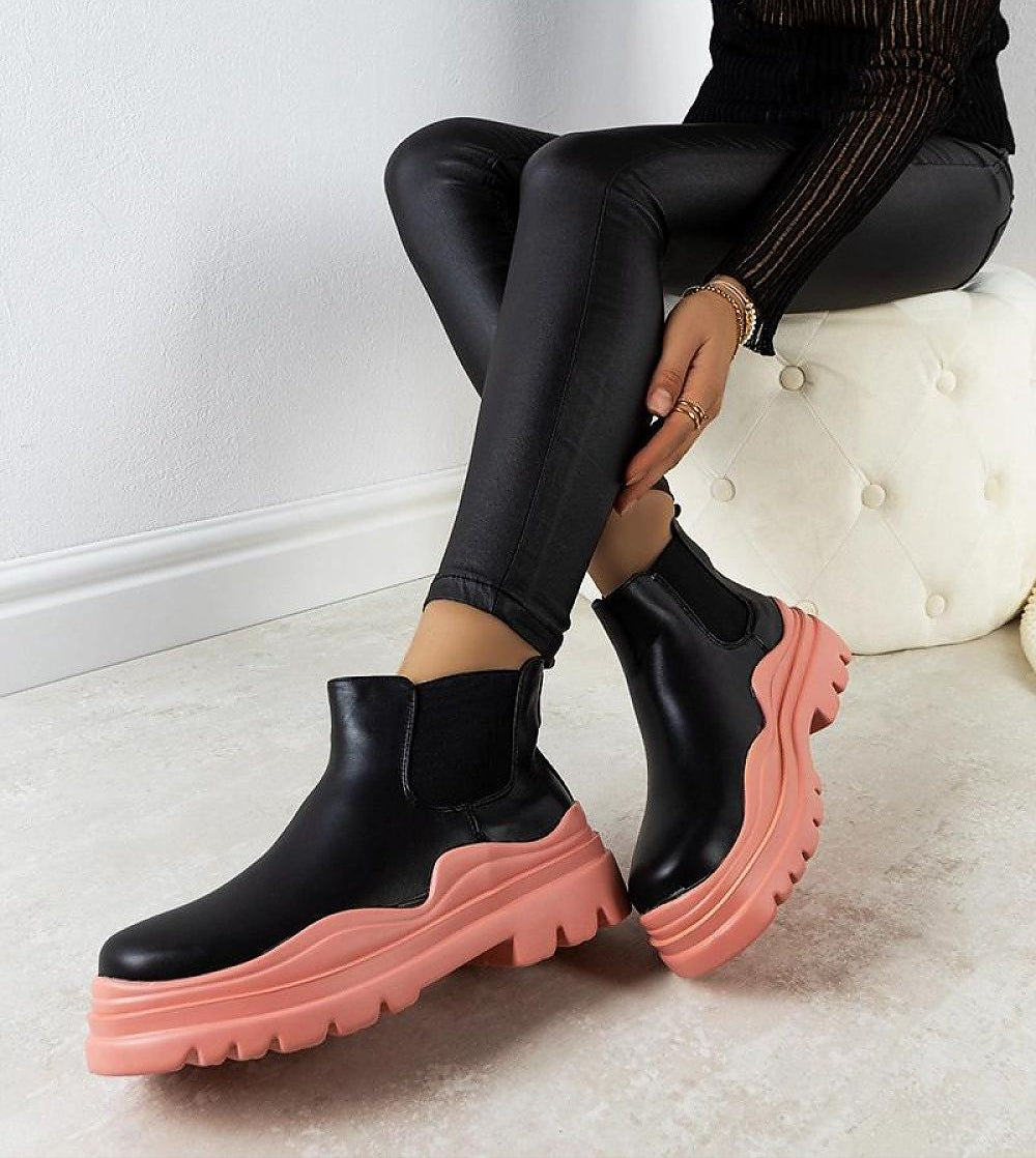 Ravela black boots with pink platform, crafted from eco leather, featuring elastic side inserts and a vibrant 4.5 cm sole.