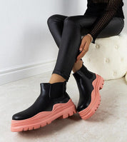 Ravela black boots with pink platform, crafted from eco leather, featuring elastic side inserts and a vibrant 4.5 cm sole.