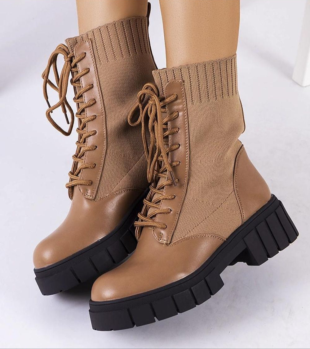 Braveda brown elastic-top boots with lace-up design, featuring flexible fabric upper and black treaded sole on white background.