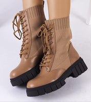 Braveda brown elastic-top boots with lace-up design, featuring flexible fabric upper and black treaded sole on white background.