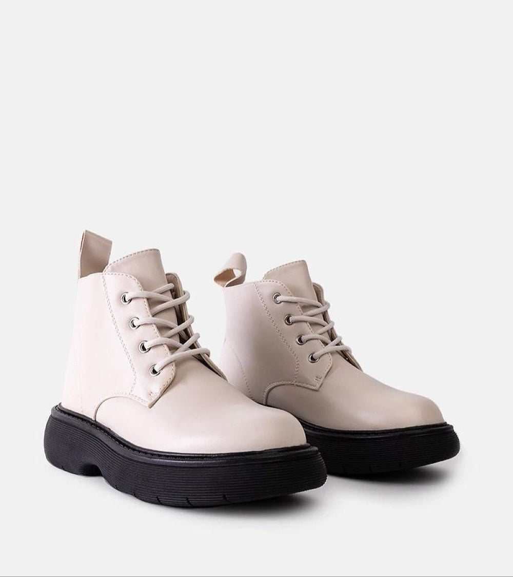 Matte white Solvaira lace-up boots with thick treaded sole, eco leather, ideal for fall. Minimalist and urban style footwear.