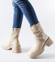 Beige Maressa Insulated Ankle Boots with block heel and buckle detail, styled with blue jeans, offering warmth and style.