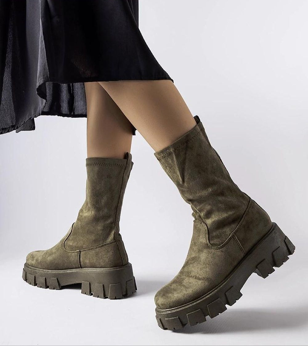 Green Verossa Eco-Suede Sock Boots on woman, featuring soft upper, round toe, rubber sole, and 5.5 cm heel for comfort and style.