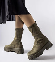 Green Verossa Eco-Suede Sock Boots on woman, featuring soft upper, round toe, rubber sole, and 5.5 cm heel for comfort and style.