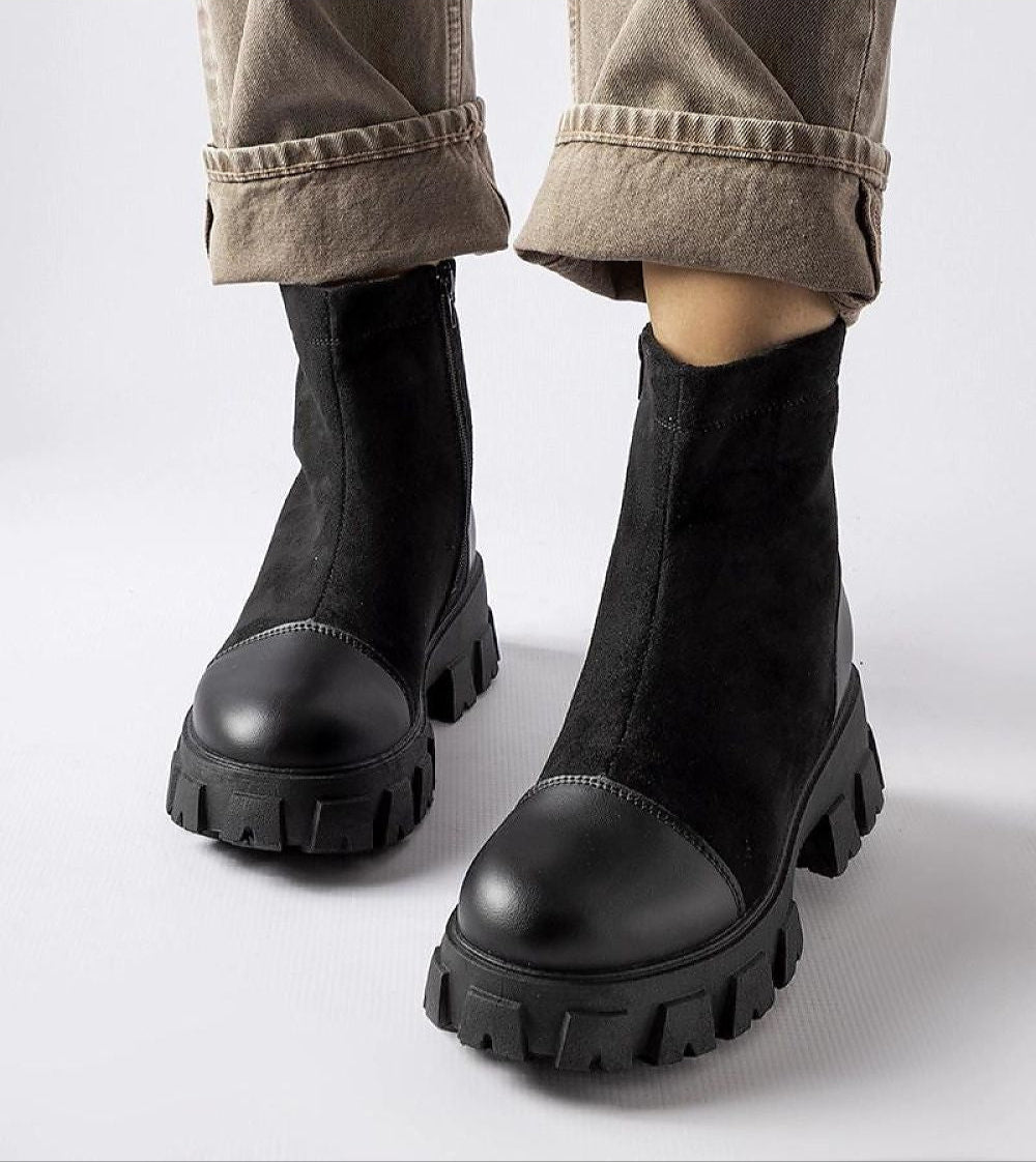 Trevaya suede platform baggers in black with block heel, rugged rubber sole, and side zipper, ideal for cooler seasons.