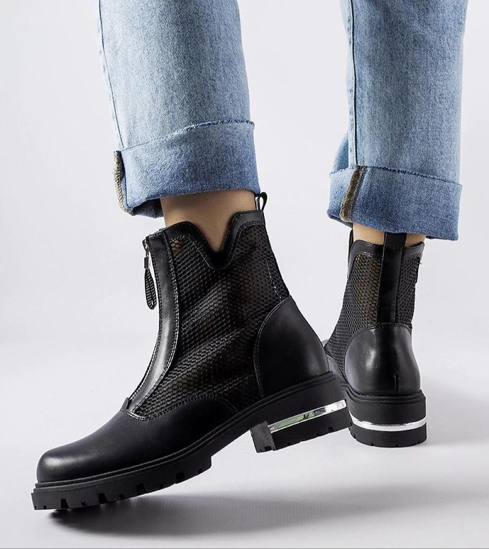 Person wearing Cavour Openwork Eco Leather Boots with a side zipper, showcasing intricate pattern and modern elegance.