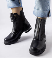 Cavour openwork eco leather boots with side zippers, combining modern elegance and comfort, worn with cuffed jeans.