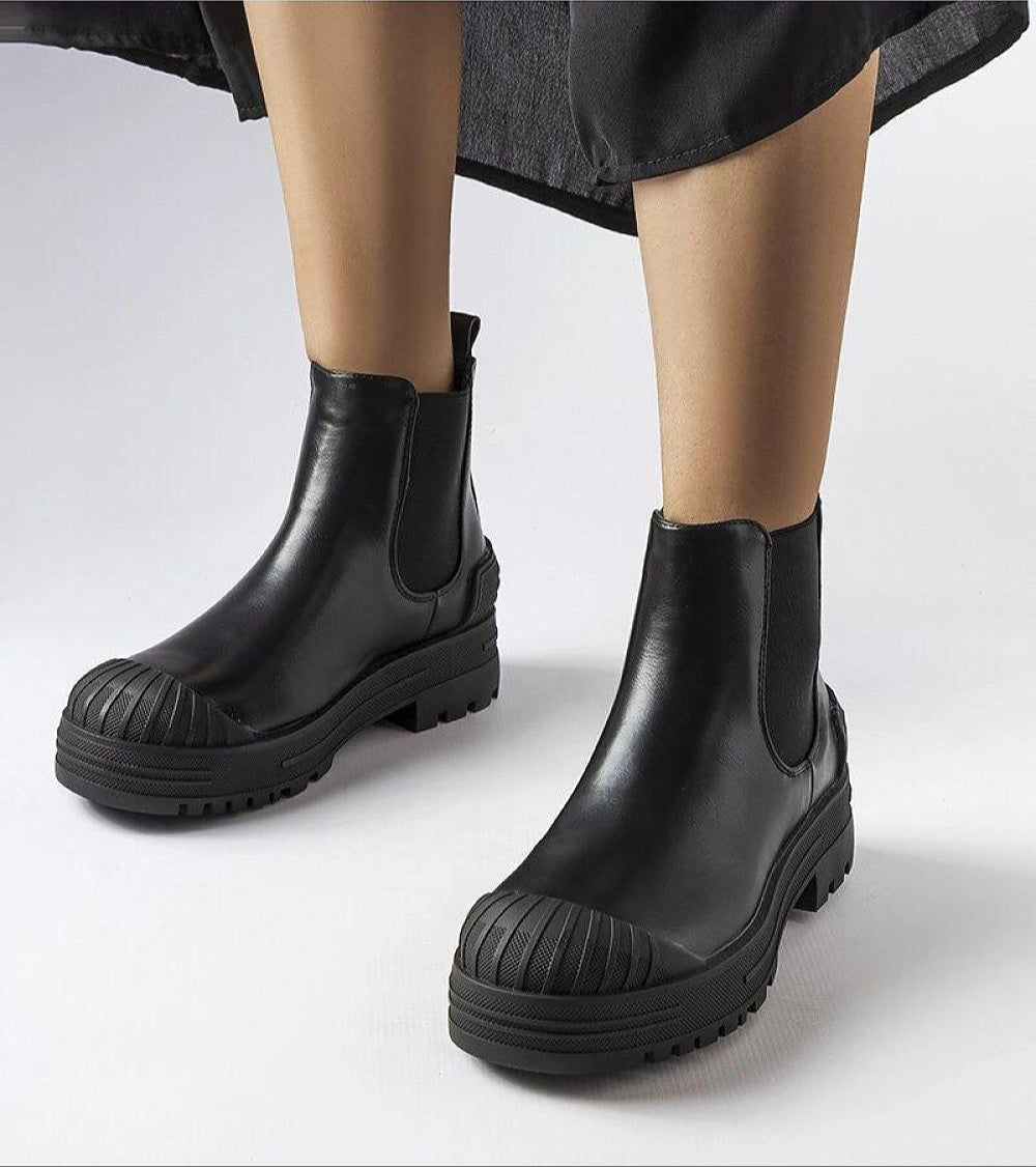 Black slip-on bagger boots with matte eco-suede and rubber insets, high upper, 4.5 cm platform heel, perfect for cold seasons.