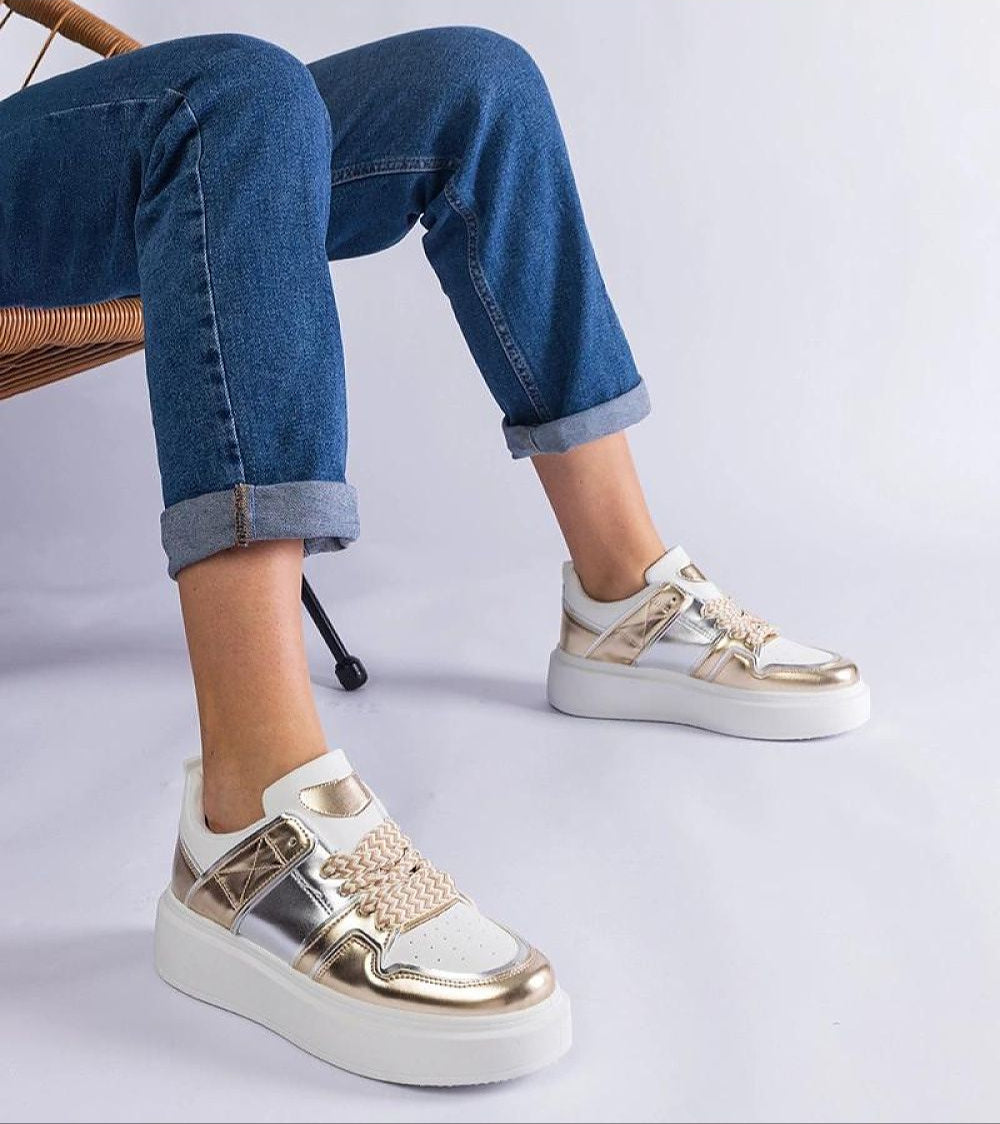 Person wearing Olyssia Layered Shine Lace Sneakers with eco leather and 4 cm rubber sole for casual style and comfort.