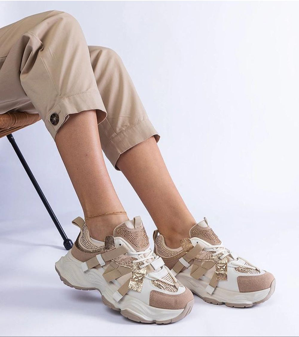 Avessia Elevated Suede Accent Sneakers with shimmering inserts, beige pants, and a 6 cm platform, perfect for casual outfits.