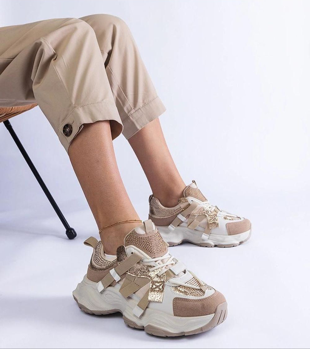 Person wearing Avessia Elevated Suede Accent Sneakers with shimmering inserts and sculpted sole.