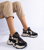 Woman wearing Avessia Elevated Suede Accent Sneakers with a 6 cm platform, featuring black eco suede and shimmering inserts.