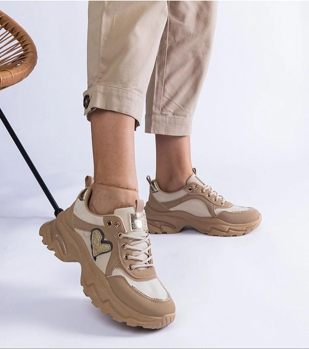 Orevia Heart-Detailed Brown Sneakers with sculpted platform, heart accent, and eco leather, showcasing unique style and comfort.