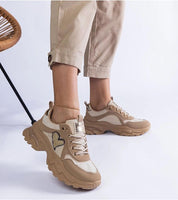 Orevia Heart-Detailed Brown Sneakers with sculpted platform, heart accent, and eco leather, showcasing unique style and comfort.