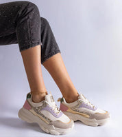Person wearing Elyvanna Brocade Panel Suede Sneakers with beige suede and shimmering brocade accents, featuring a thick white rubber sole.