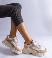 Person wearing Elyvanna Brocade Panel Suede Sneakers with thick white sole, showcasing brocade and suede texture.