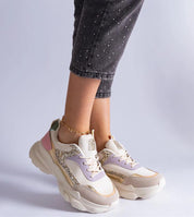 Elyvanna Brocade Panel Suede Sneakers with glittering accents and white rubber sole, worn with cropped jeans.