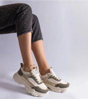 Elyvanna Brocade Panel Suede Sneakers with beige suede, brocade accents, thick white rubber sole, and lace-up design.