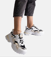 Selvyna Contrast Sport Sneakers with black and white design, eco leather finish, 5 cm supportive sole, and lace-up closure for a custom fit.