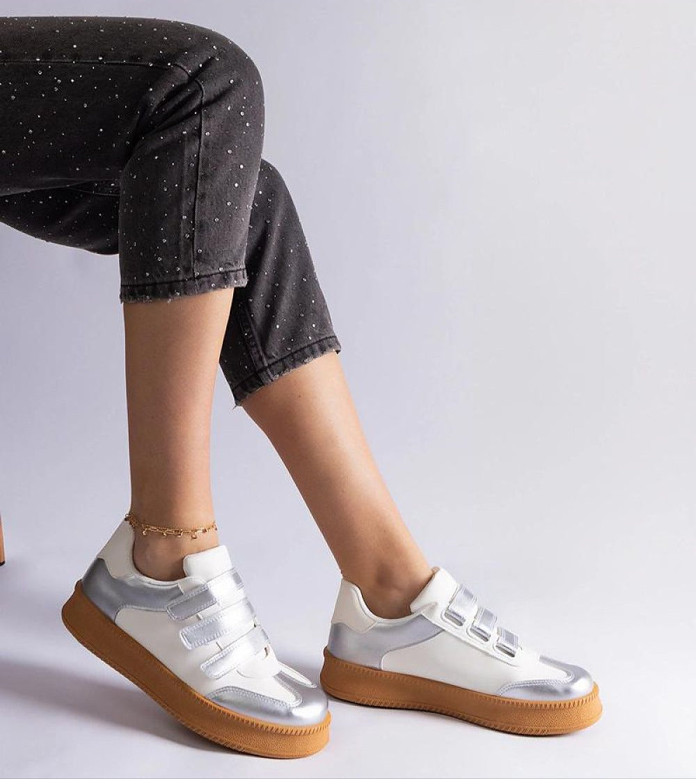 Person wearing Elurea Gold Velcro Street Sneakers with brown rubber soles, showcasing stylish design and eco leather material.