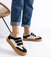 Person wearing Elurea Gold Velcro Street Sneakers with eco leather upper and brown rubber sole.