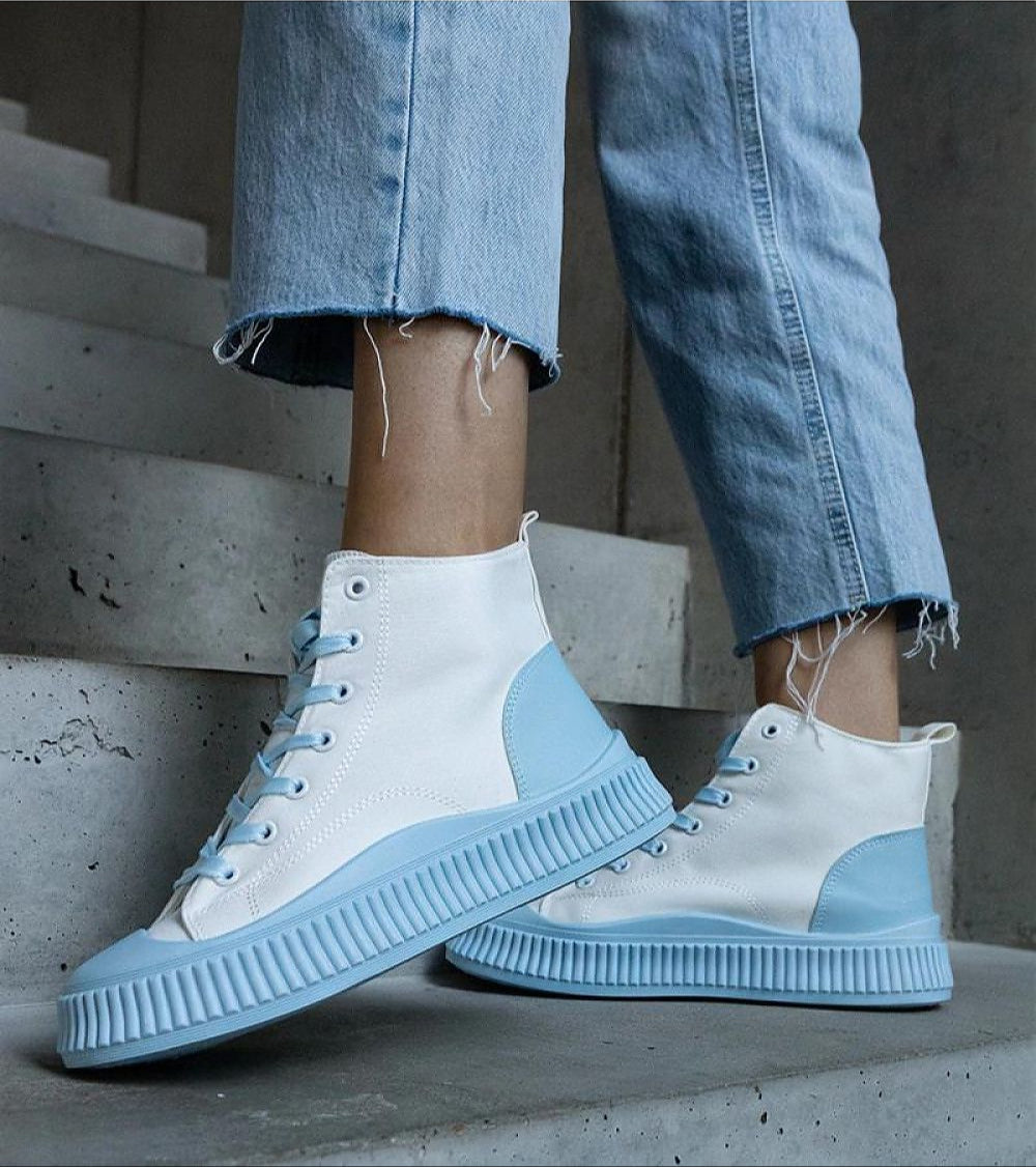 Ossavine fabric platform lace sneakers with blue accents worn by person on steps, showcasing casual and elevated style.