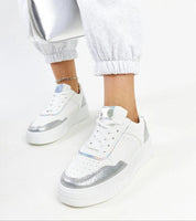Norevia Silver-Edged Sneakers with sculpted silhouette, silver accents, chunky white sole, matte leather, and suede-like textures.