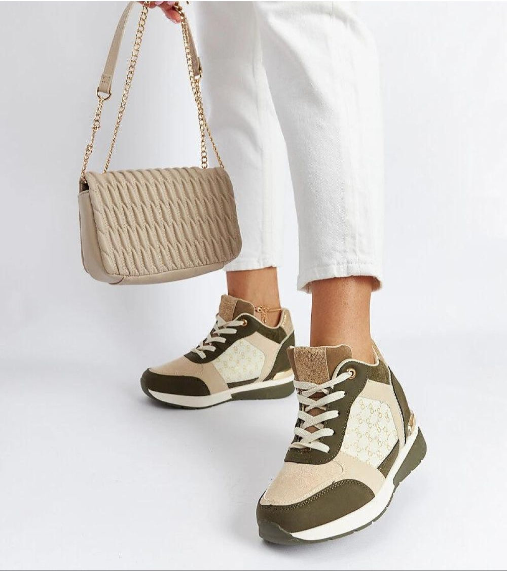 Stylish ankle-high sneakers in beige and olive tones paired with white pants and a beige quilted handbag, showcasing a trendy casual look.