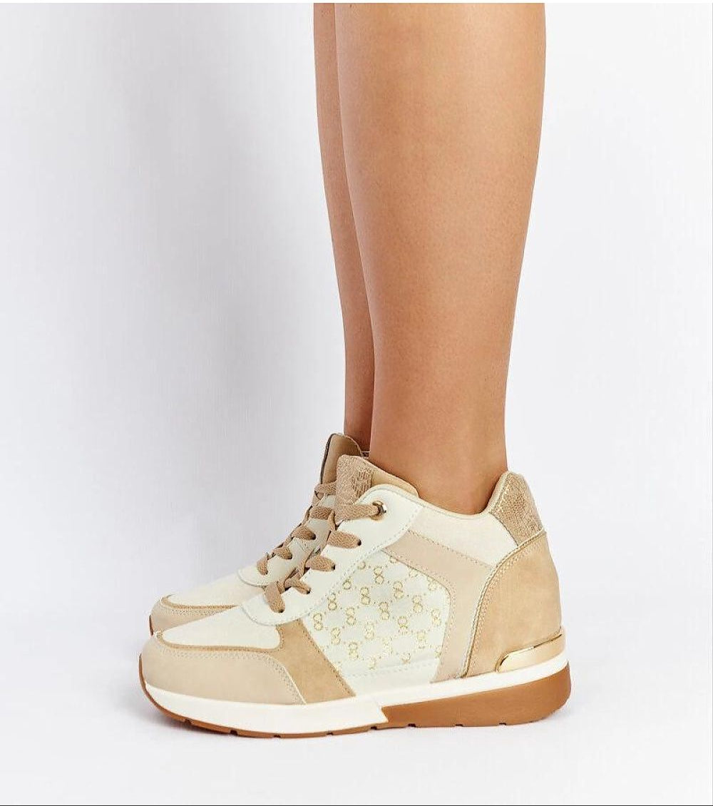 Side view of beige wedge sneakers with lace-up closure, featuring a stylish pattern and comfortable sole for casual wear.