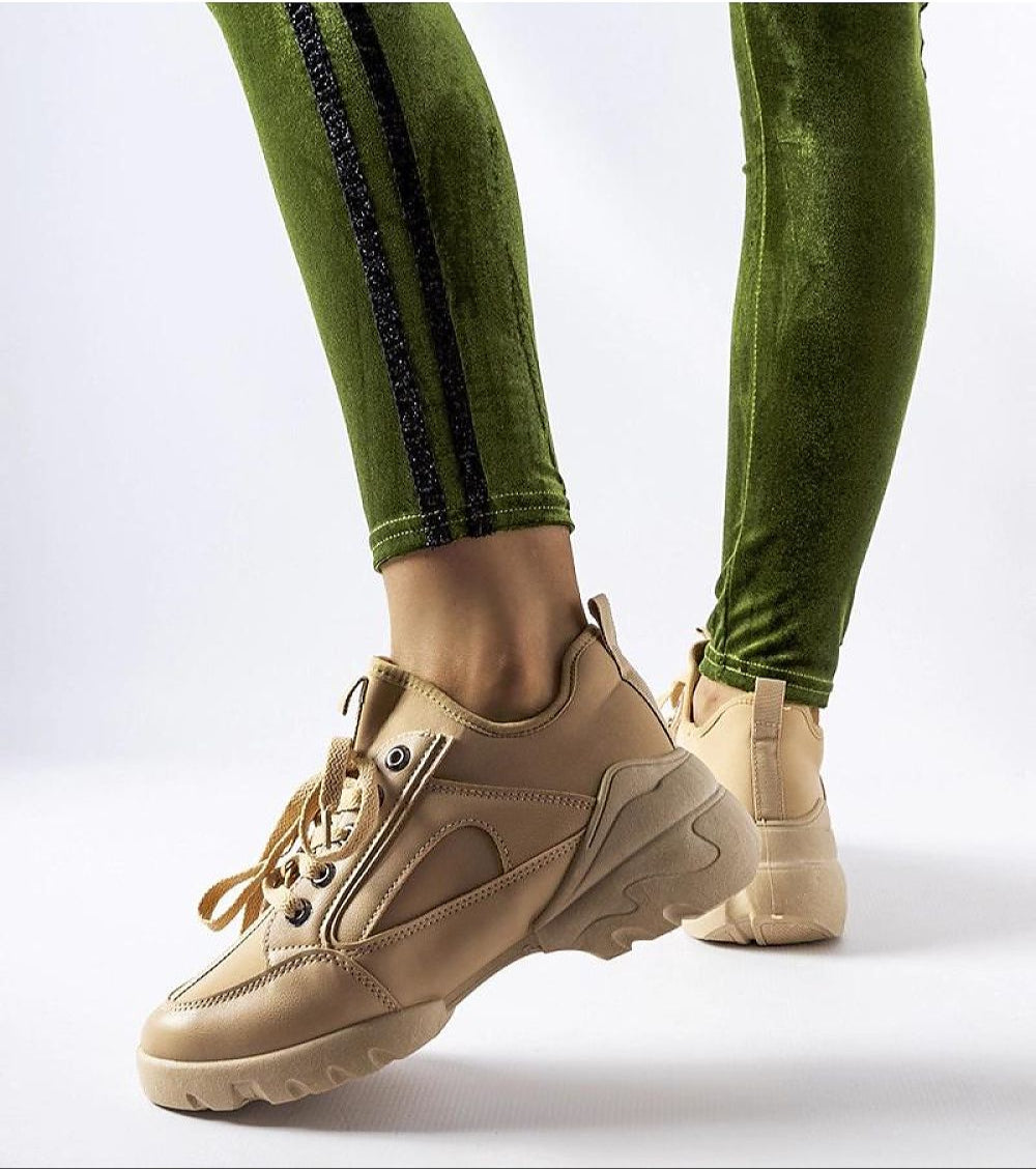 Eralina flexible sole summer sneakers in beige with 5 cm heel, paired with green leggings, showcasing lace-up closure design.