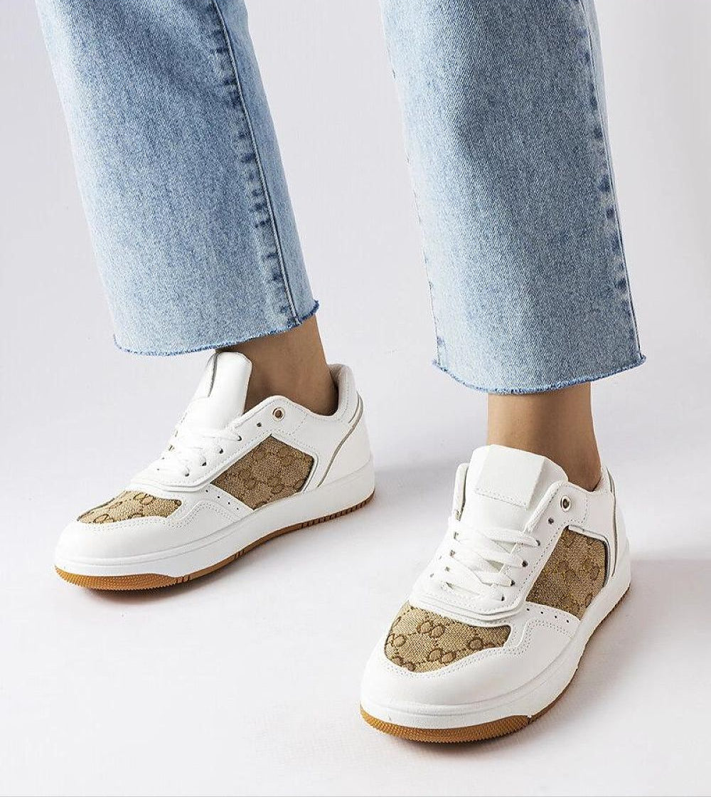 Model wearing Melienne White Monogram Lace-Up Sneakers with eco-leather and rubber sole, showcasing a stylish and casual look.