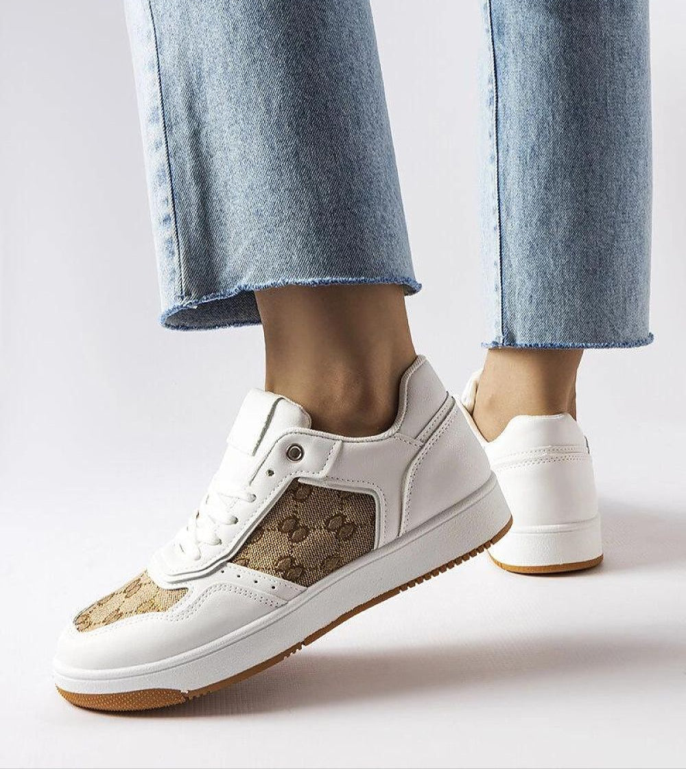 Melienne White Monogram Lace-Up Sneakers with eco-leather and rubber sole, shown worn casually with denim jeans.