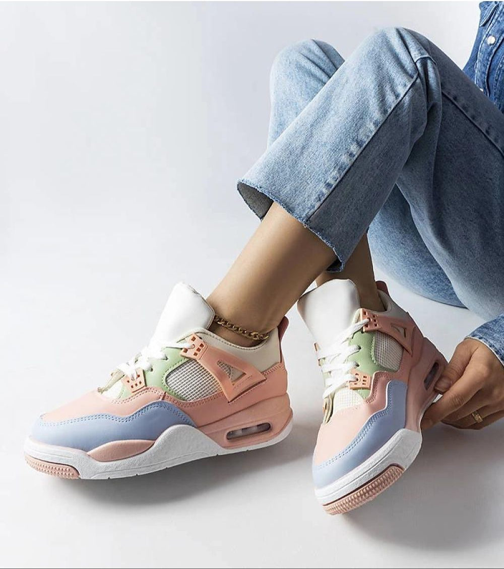 Pastel-colored sneakers worn with light jeans, showcasing a stylish, comfortable design ideal for casual and trendy outfits.