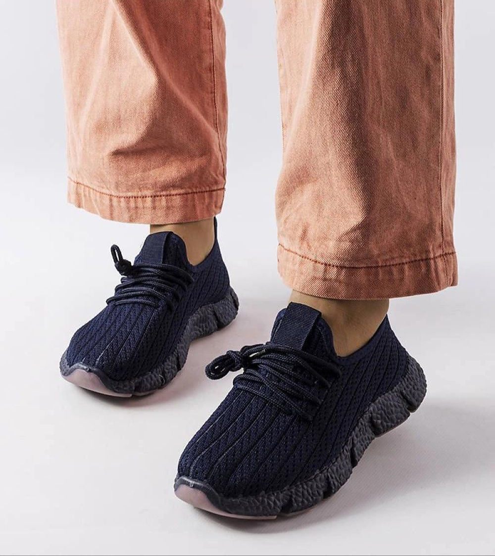 Model wearing Arvène Navy Summer Sport Sneakers with breathable fabric and 3 cm rubber sole for comfort and style in warmer weather.