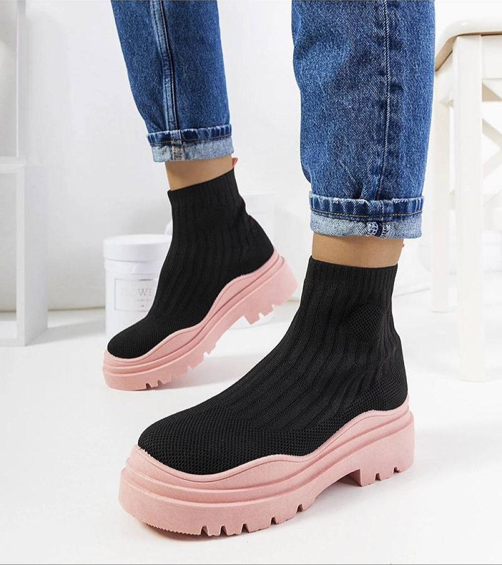 Velaria Black & Pink Slip-On Sneakers with black textile upper and pink sole, showcasing comfort and bold style for dynamic, effortless fashion.