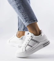 Person wearing Meralla Rhinestone Platform Sneakers with shimmering details and beige tone, perfect for casual city strolls and warm-weather outfits.