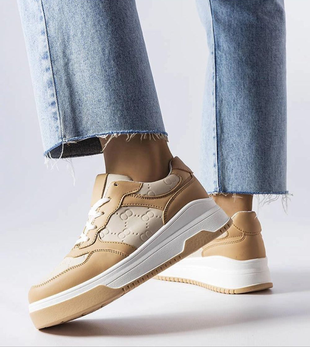 Mirevon Embossed Platform Sneakers in tan, featuring embossed details and 5cm rubber soles, paired with light denim jeans.