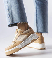 Mirevon Embossed Platform Sneakers in tan, featuring embossed details and 5cm rubber soles, paired with light denim jeans.