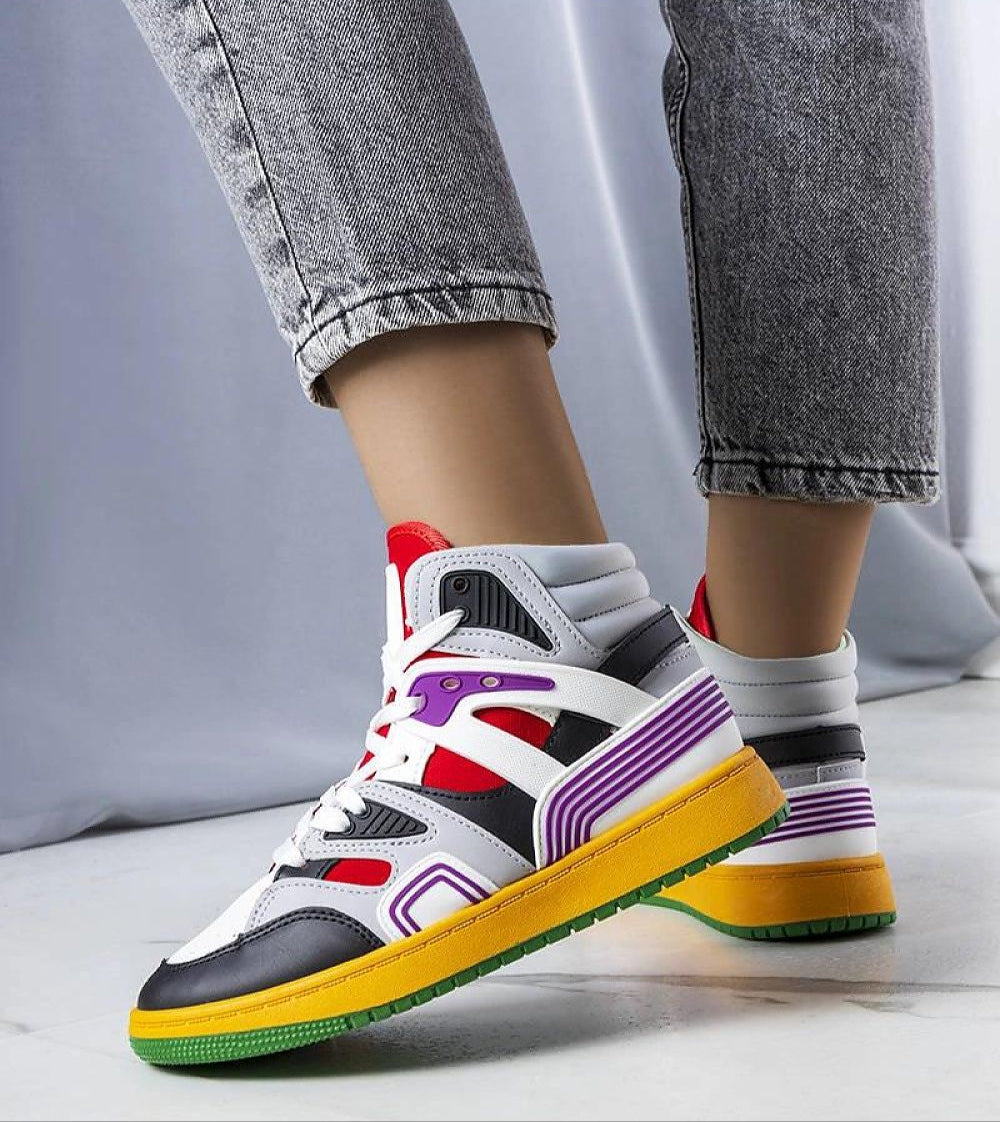 Person wearing colorful Dervina Classic High-Top Sneakers with eco leather and 3 cm rubber sole on white floor.