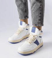 Person wearing Ormelya High-Top Everyday Sneakers in white and blue with eco leather upper and 3 cm sole, showcasing casual styling.