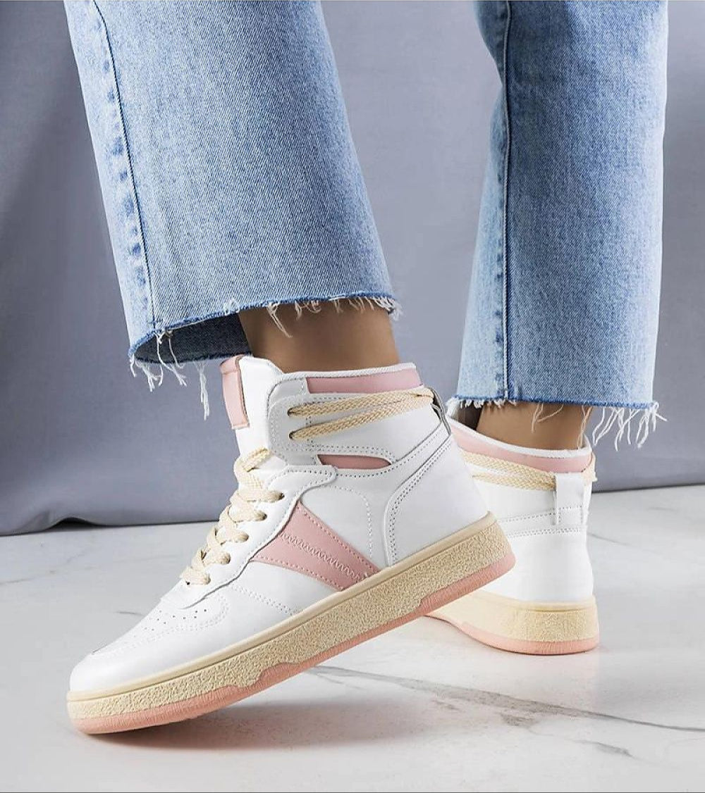 Person wearing Ormelya High-Top Everyday Sneakers in white with pink accents, paired with blue jeans on a marble floor.