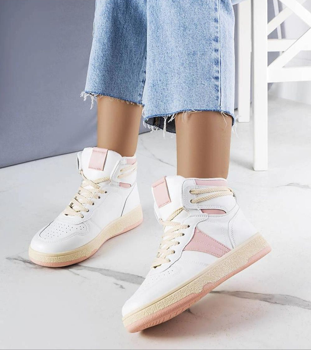 Woman wearing Ormelya high-top sneakers with pink accents and frayed jeans, showcasing stylish casual footwear.