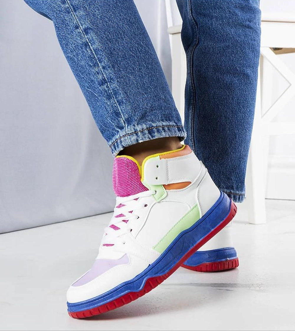 Colorful high-top sneakers with a lace-up design and vibrant sole, paired with denim jeans, perfect for casual wear.