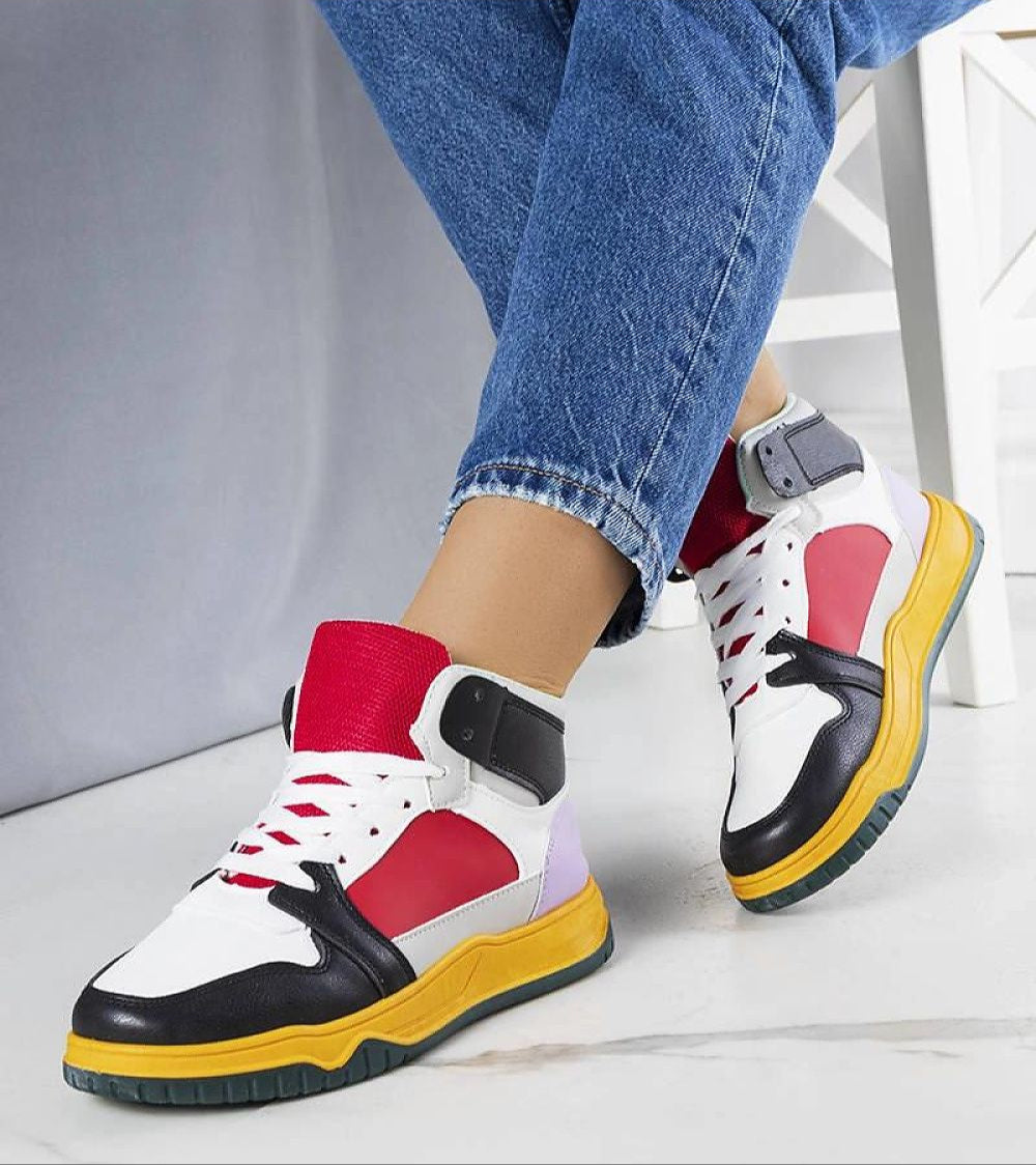 Person wearing colorful ankle sneakers with a suede-touch finish and supportive design, perfect for casual summer wear.