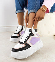 Person wearing Darellin Sculpted Ankle Lace Sneakers with eco leather upper and 5 cm rubber sole, highlighting modern design.